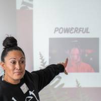 Girls of Color Summit previous event with a girl pointing at a presentation